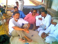 How and when it started: a meeting with villagers seated on the ground