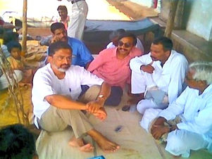 How and when it started: a meeting with villagers seated on the ground