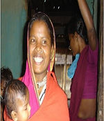 Photo gallery: a smiling mother carrying her baby