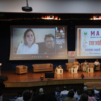 Silver Jubilee Gratitude Ceremony: guests joining by video call, audience in the hall
